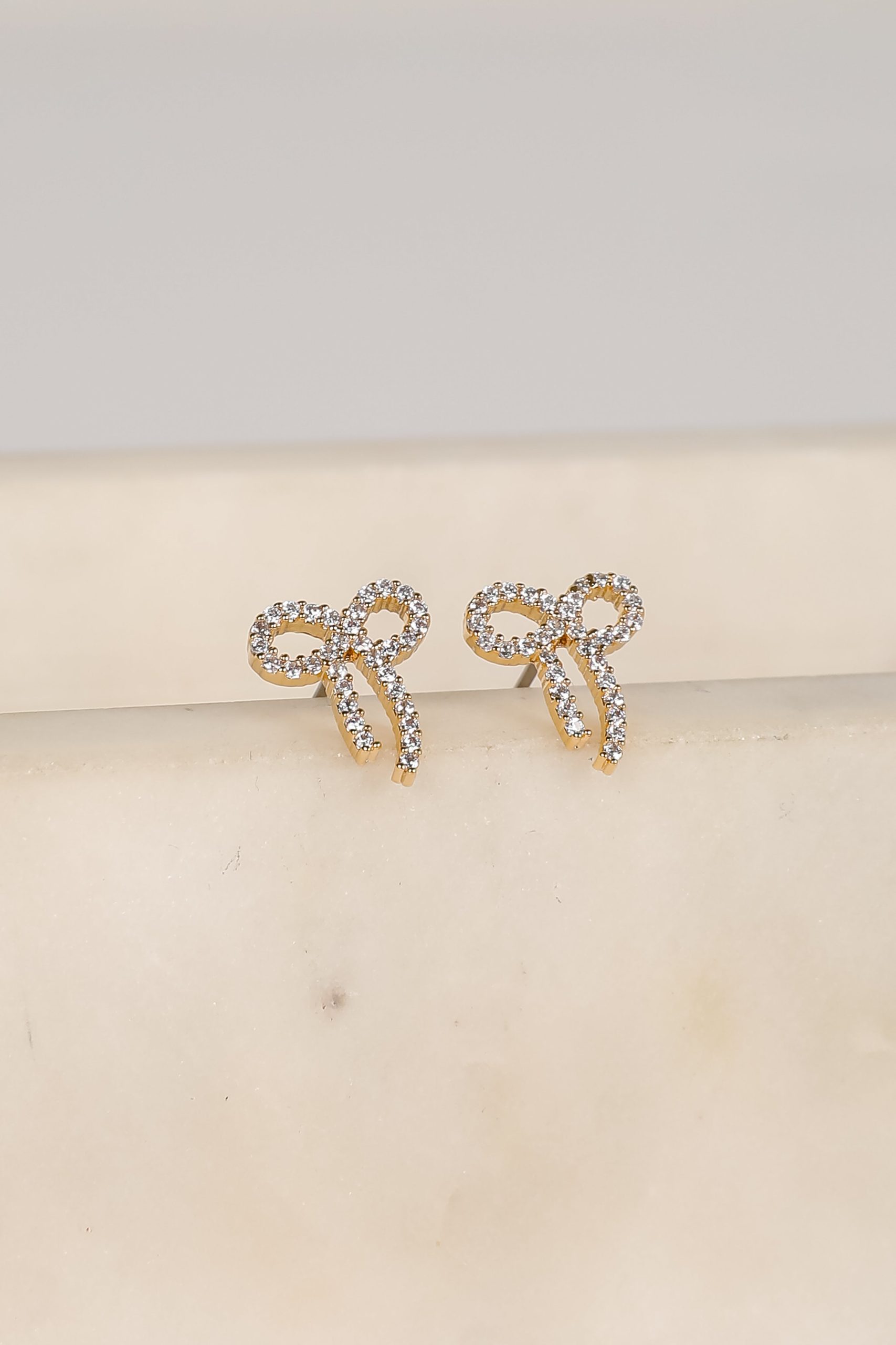 shopdressup_gold_rhinestone_bow_earrings-3_8943a79b-decb-4b8d-b319-787147a84da4.jpg
