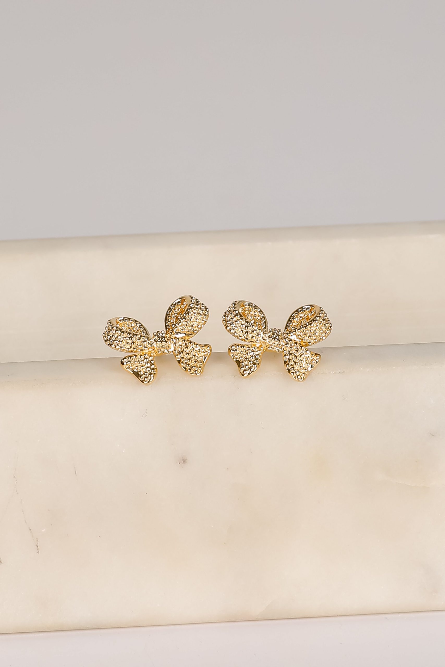 shopdressup_gold_textured_bow_earrings.jpg